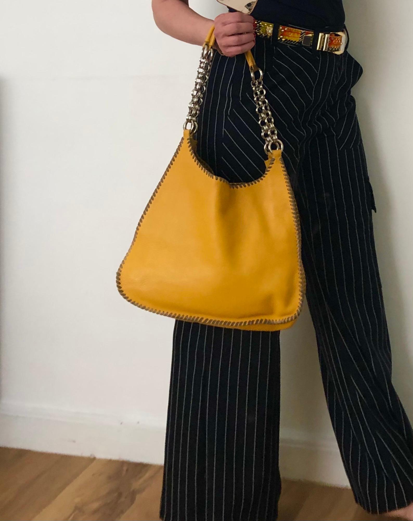 FREE UK and WORLDWIDE DELIVERY 

Madras Leather Prada hobo bag in bright Yellow featuring magnetic button closure and double shoulder straps with part chain and part leather straps. It also has an internal zip pocket and lovely stitching detail all