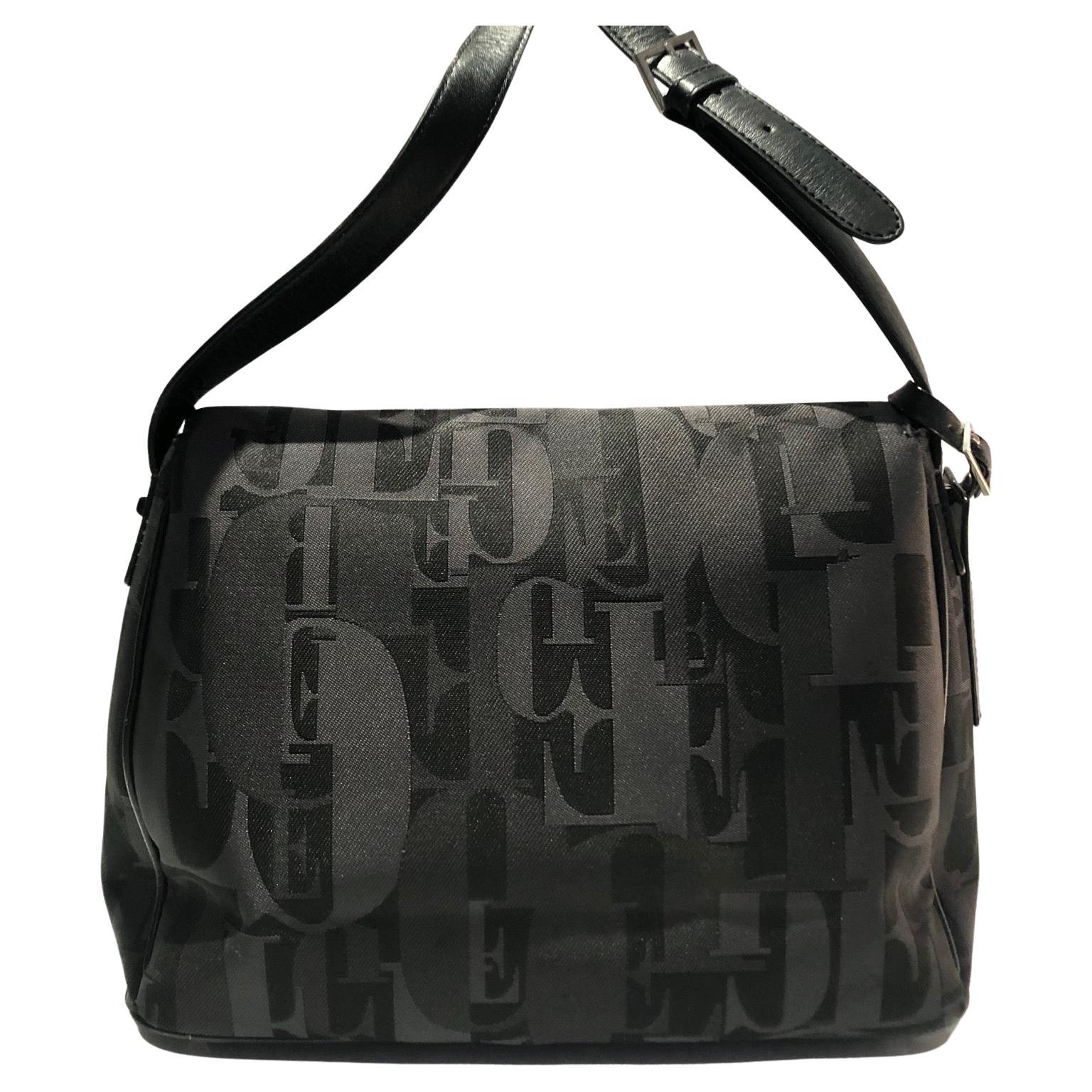 Black Gianfranco Ferre Logo Print Shoulder Crossbody bag, waterproof fabric, internal zipped pocket, 2 additional open compartments. The cross body strap is fully adjustable and in black leather Logo tag

Measurements: approximately 11.5” wide and