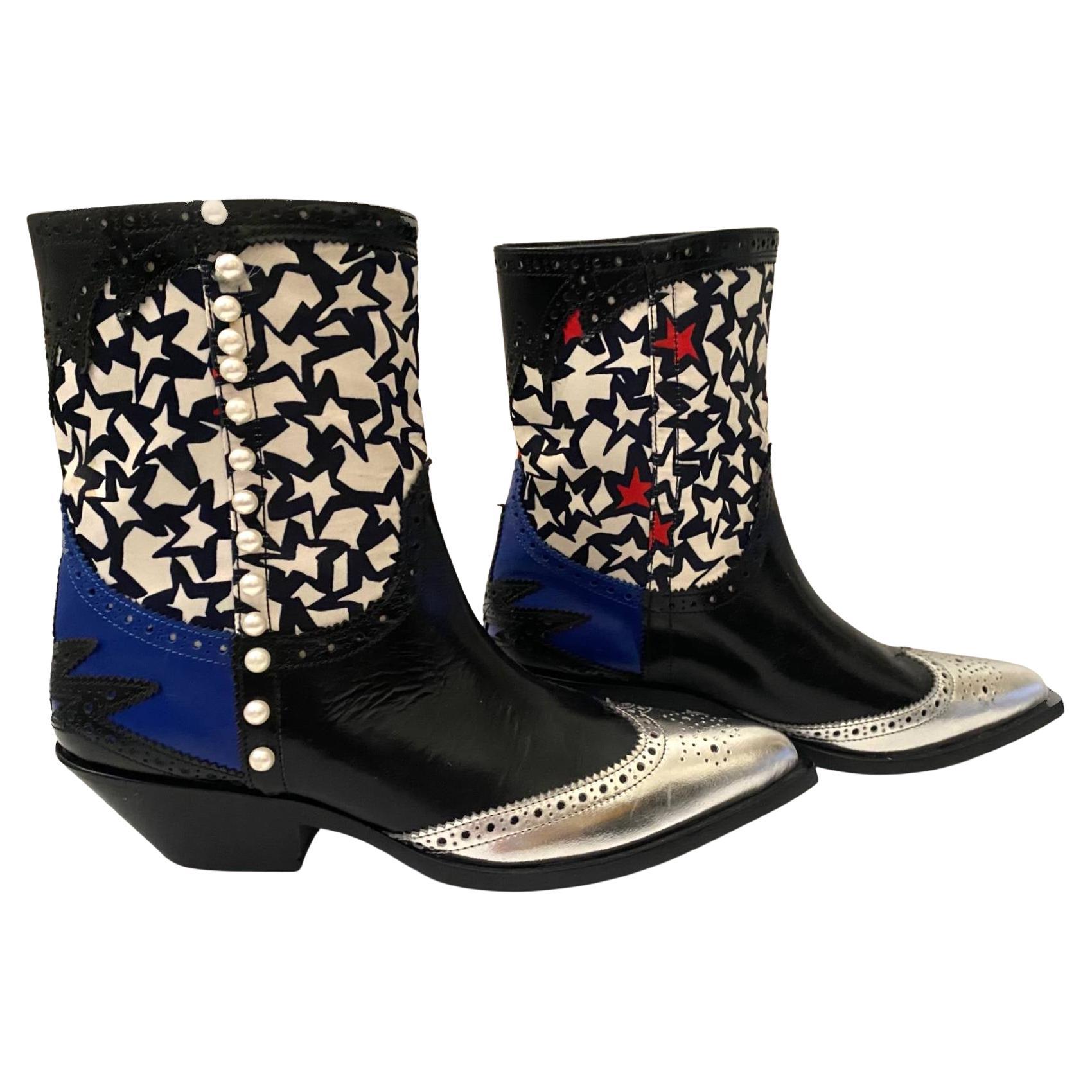 Massimo Giorgetti has cited one of his main creative inspirations as art, which infiltrates into his designs and is a defining factor in his modern collections. These leather western style boots from MSGM have many artistic features including: