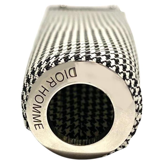 Christian Dior Dogtooth Toothpaste Tube Sleeve Cove, washable fabric, chrome clip at the bottom to release and insert tube; the sleeve cover securely contains the tube while providing a stylish touch to bathroom accessories. The clip feature aids in