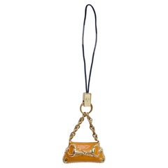 2000s Vintage Gucci Orange Metal Lacquered Horsebit Miniature Bag Charm Keyring