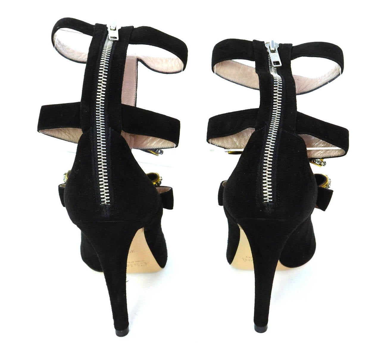Features three black suede bows with crystal encrusted detailing

-Made in: Italy
-Color: Black
-Composition: Suede
-Sole Marked: CHLOE MADE IN ITALY 39.5
-Closure: Back zip closure
-Includes: Chloe box and dust bag
-Overall Condition: New,