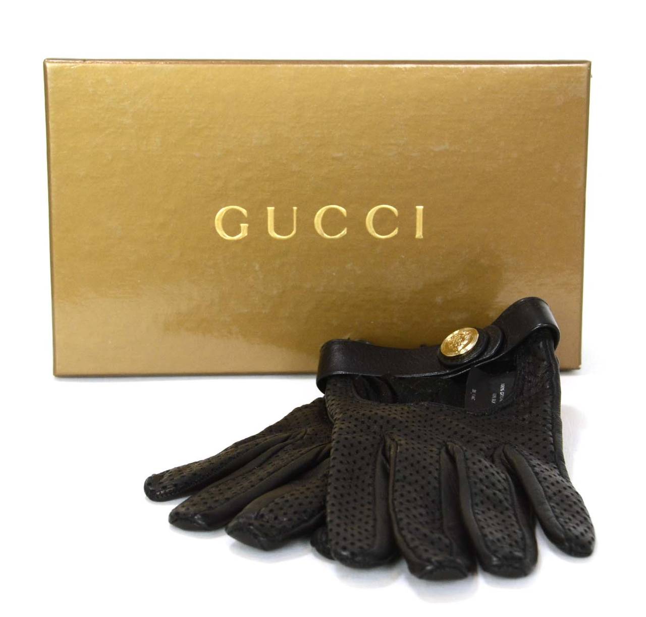 Features goldtone Gucci coat of arms button snap

-Made in: Italy
-Color: Black
-Composition: 100% leather
-Tags: GUCCI MADE IN ITALY
-Lining: 100% silk
-Closure/opening: Leather strap w/ snap closure
-Includes: Gucci box
-Overall