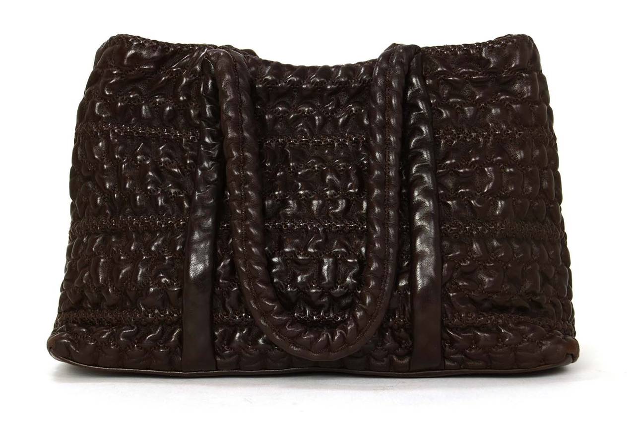 Chanel Brown Puckered Leather Shoulder Bag
Comes with attached CHANEL CC ruthentium medallion

Made in: Italy
Year of Production: 2009
Color: Chocolate brown
Hardware: Ruthentium
Materials: Lambskin leather
Lining: Grey