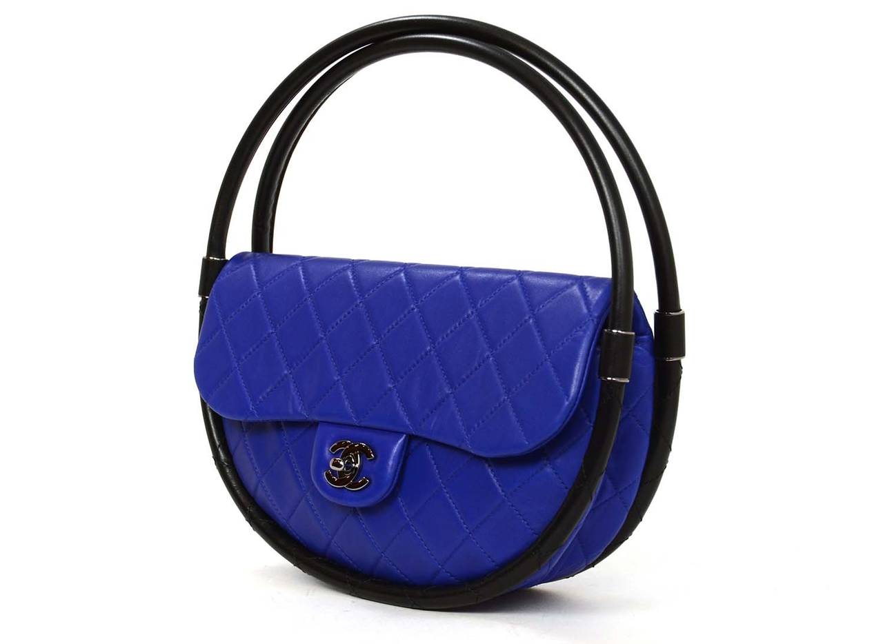 -Made in: France
-Year of Production: 2013
-Color: Cobalt blue with black trim
-Hardware: Gun metal
-Materials: Leather, metal
-Lining: Blue textile
-Closure/opening: Flap w/ cc twistlock closure
-Exterior Pockets: One back patch
