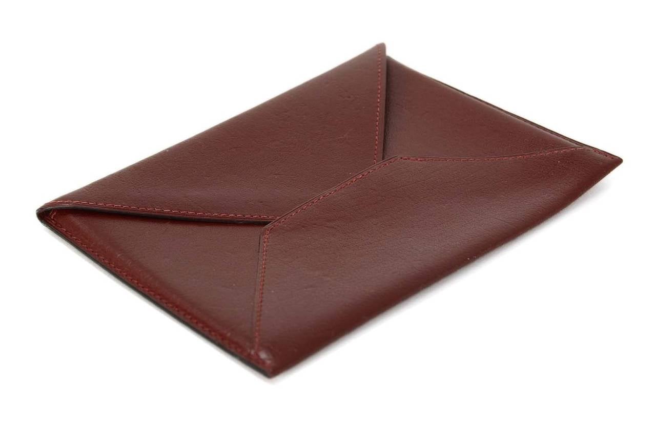 HERMES 2002 Rouge H Chevre Leather Envelope Passport Holder

    Made in: France
    Year of Production: 2002
    Color: Rouge
    Materials: Chevre
    Lining: Smooth leather
    Closure/opening: Envelope flap
    Serial Number/Date Stamp: