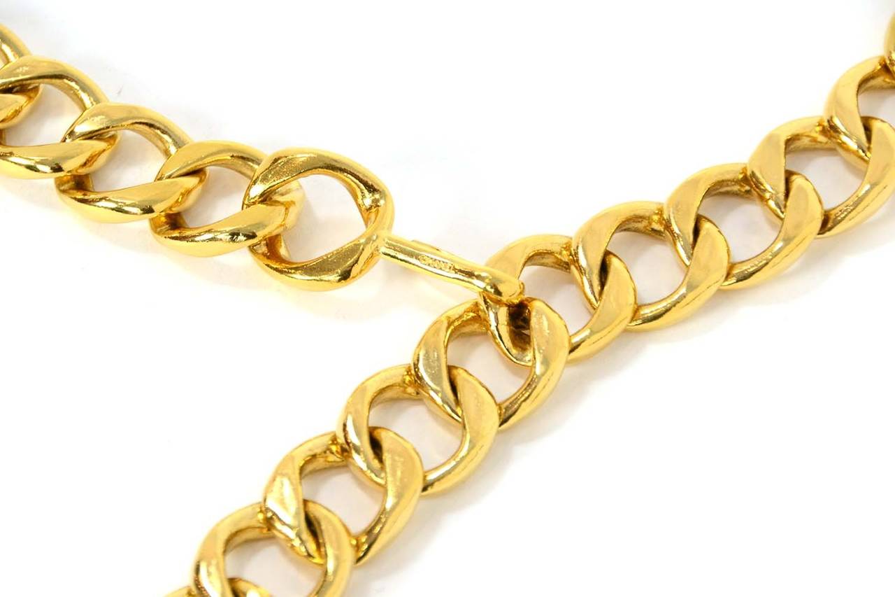 CHANEL Goldtone Chain Link Belt W/ CC Medallion

    Made in: France
    Year of Production: C. 1950's-1960's
    Stamp: CHANEL
    Closure: Hook closure
    Color: Gold
    Materials: Goldtone metal
    Overall Condition: Good vintage