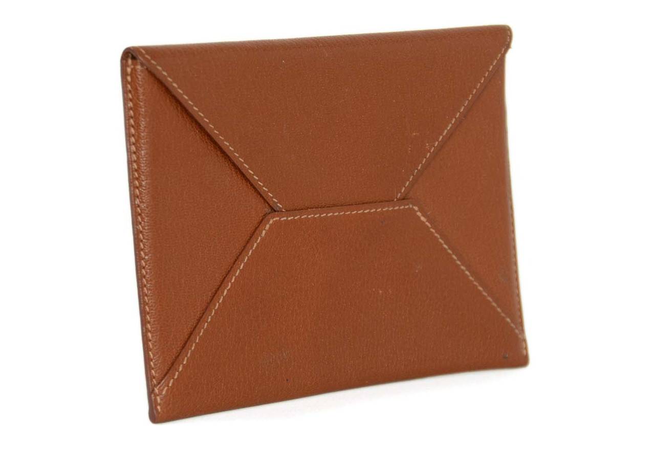 HERMES 2000 Tan Chevre Leather Envelope Pouch/Passport Holder

    Made in: France
    Year of Production: 2011
    Color: Tan
    Materials: Chevre leather
    Lining: Chevre leather
    Closure/opening: Envelope flap
    Serial Number/Date