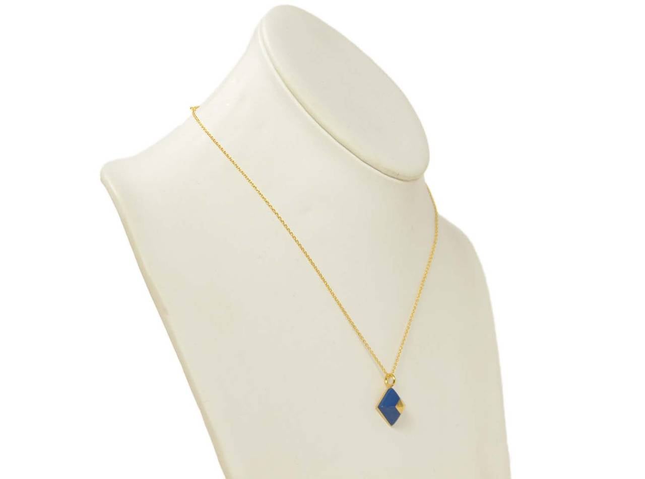 HERMES Medor Cupidon Blue/Gold Pendant/Necklace C.2011

    Made in: France
    Year of Production: 2011
    Stamp: O in a square
    Closure: Clip closure
    Color: Blue/gold
    Materials: Goldtone metal, Blue lacquered
    Overall