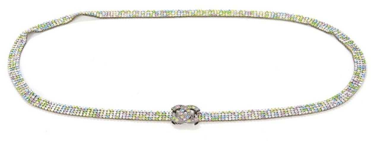 Features yellow, blue, green, pink and clear strass crystals

    Made in: France
    Year of Production: 2005
    Stamp: CHANEL 05 A MADE IN FRANCE
    Closure: Hook on back of CC buckle
    Color: Yellow, pink, blue, green, clear, gun metal,