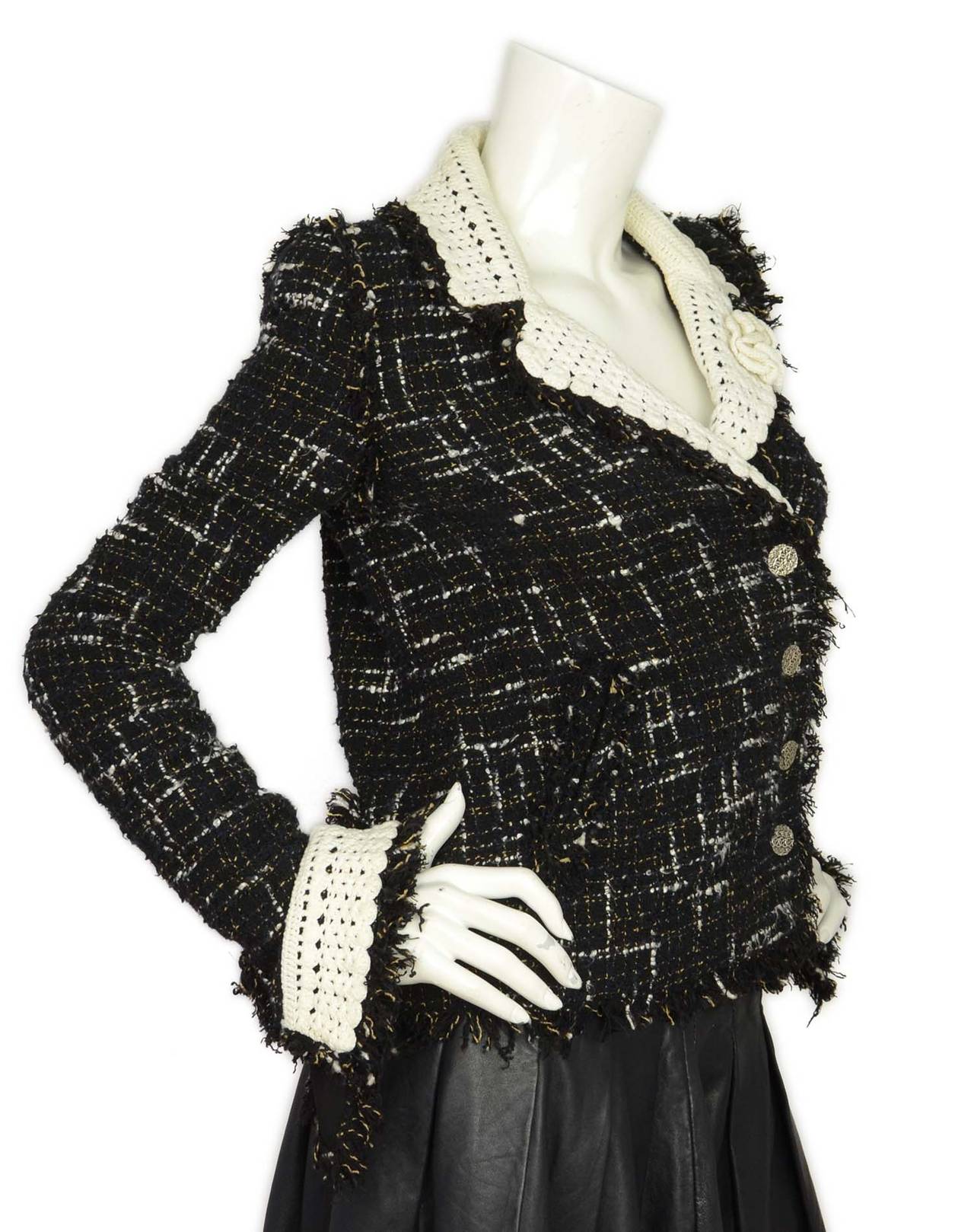 CHANEL Black and White Tweed Jacket W. White Crochet Trim

-Made in: Italy
-Year of Production: 2004
-Color: Black and White
-Composition: 73% Cotton, 16% Rayon, 10% Acrylic, 1% Polyester
-Tags: Brand and composition tags attached
-Lining: