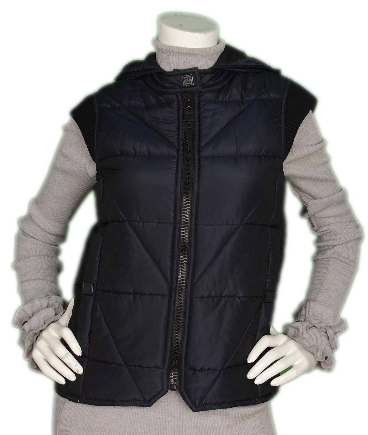 CHANEL Navy Silk Quilted Puffer Vest W/ Hood sz. 36

    Made in: France
    Year of Production: 2004
    Color: Navy
    Composition: 100% Silk
    Tags: Brand and composition tag are attached
    Lining: 100% Silk
    Closure/opening: