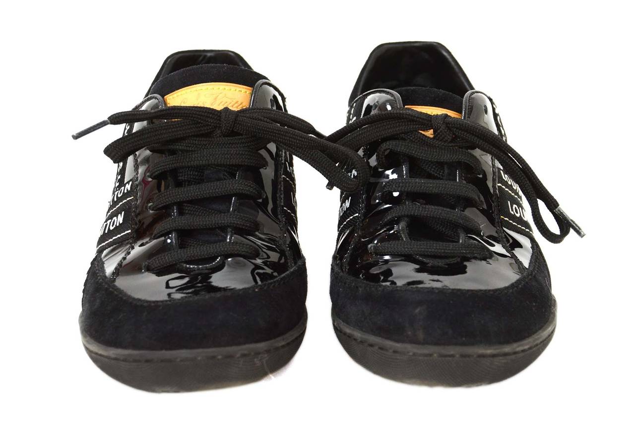 Features LOUIS VUITTON ribbon detailing

-Made in: Italy
-Year of Production: 2007
-Color: Black 
-Composition: Suede, patent leather, fabric laces and detailing
-Sole Stamp: LV
-Closure/opening: Lace up
-Overall Condition: Excellent with