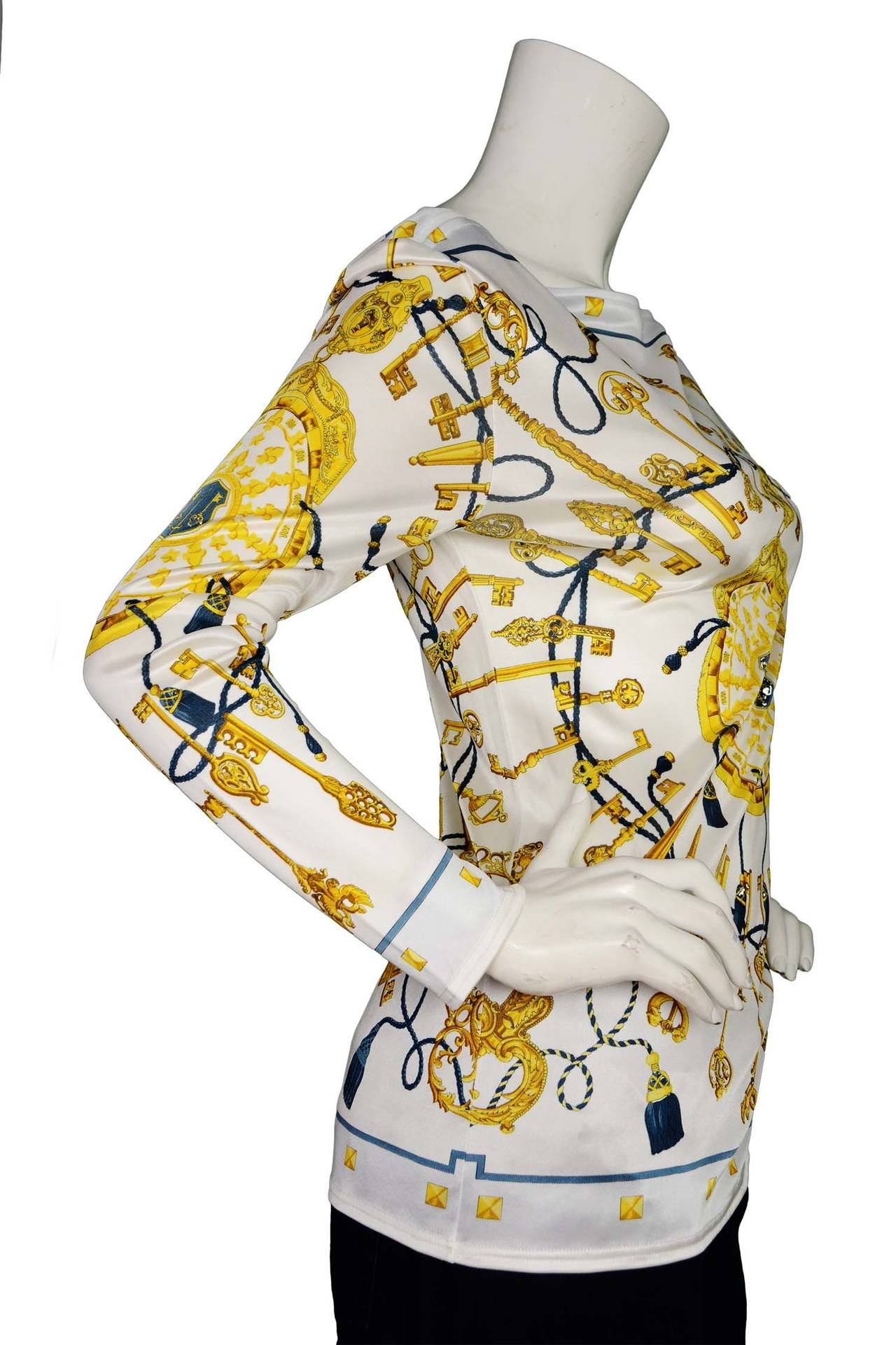 HERMES Jersey Longsleeve Top W/ Keys and Tassels Pattern sz. 6

    Made in: Italy
    Color: White with yellow
    Composition:100% Vicose
    Tags: Brand and composition tags are attached
    Lining: Unlined
    Overall Condition: Excellent