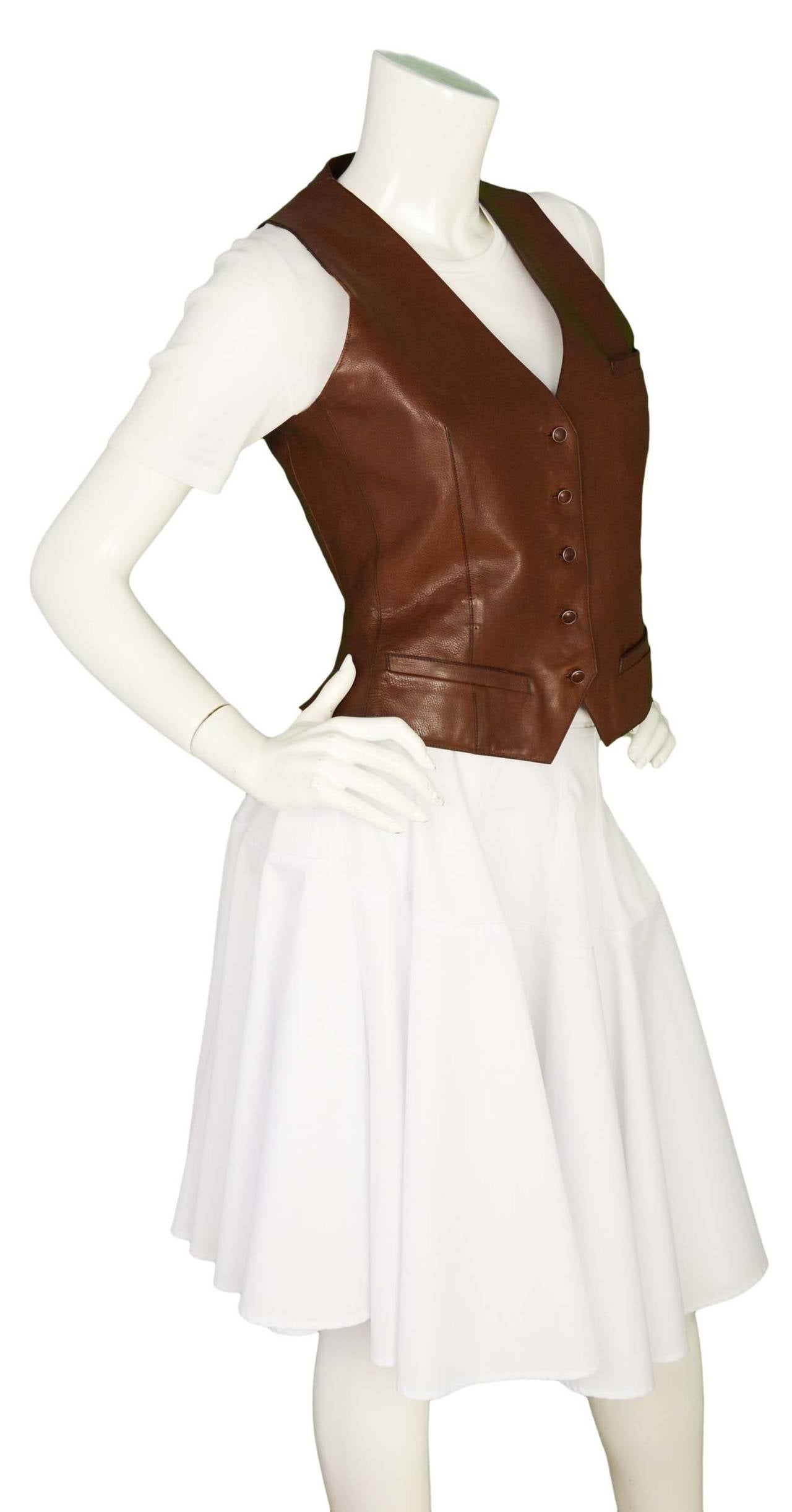 -c 21st Century
-made in France
-brown distressed leather, fabric lining
-three slit pockets
-five leather buttons
-back of vest has a slit on each side

Bust 34