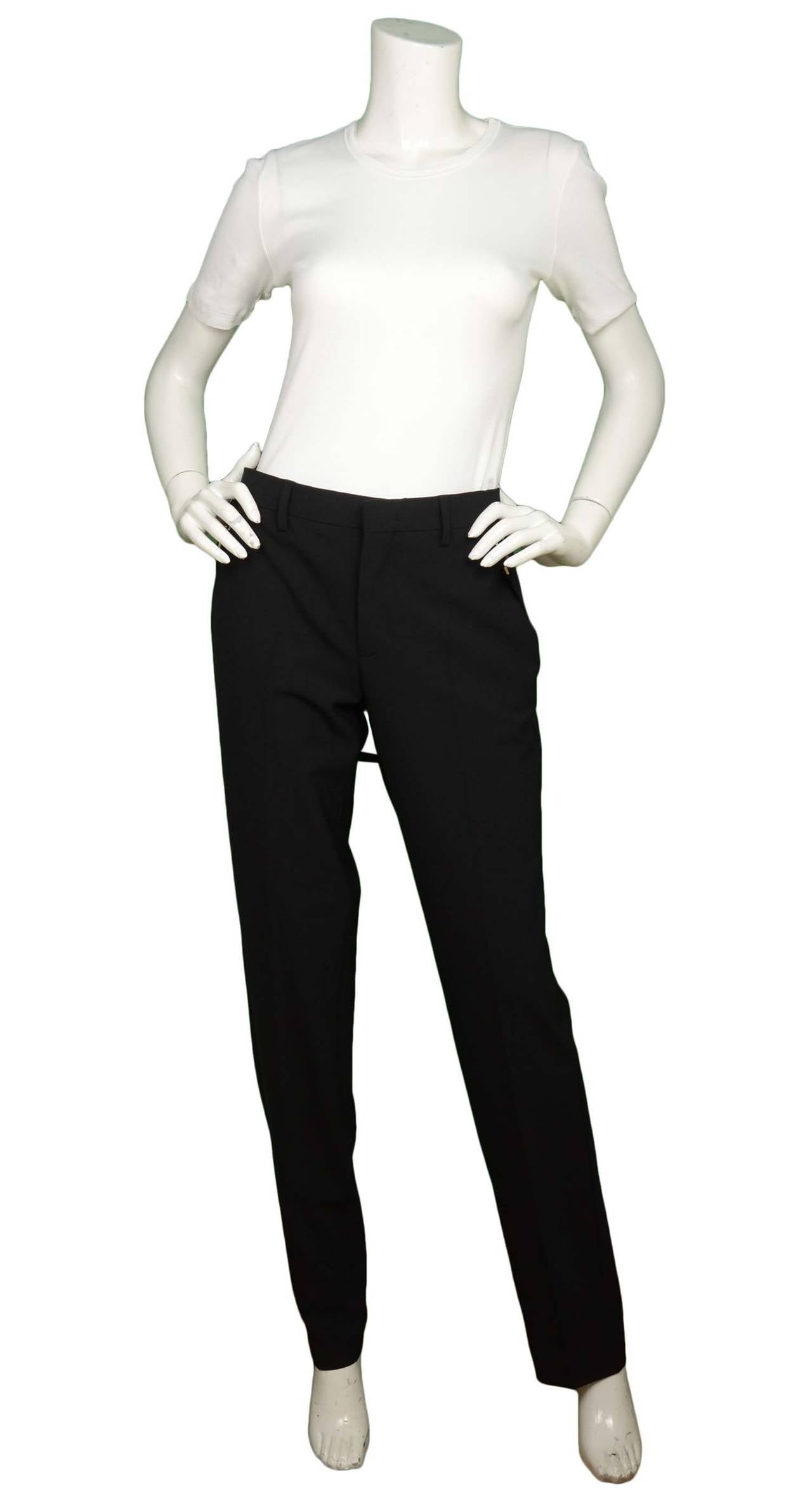 GIVENCHY Black NWT Trousers W/ Belt Detail RT $1250
Made in: Italy
Color: Black
Composition: 53% Polyester, 43% Wool, 4% Elastane
Lining: Black 100% Vicose
Closure/opening: Zipper with hook clasp
Exterior Pockets: Two pockets, one at each hip