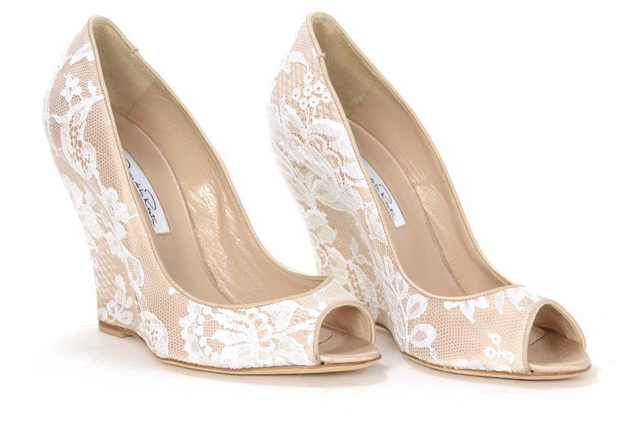 OSCAR DE LA RENTA Nude Peep-toe Wedges W/ White Lace Overlay sz. 37

    Made in: Italy
    Color: Nude/ivory
    Sole Stamp: Oscar De La Renta Made In Italy
    Closure/opening: These wedges slip-on
    Overall Condition: Excellent pre-owned