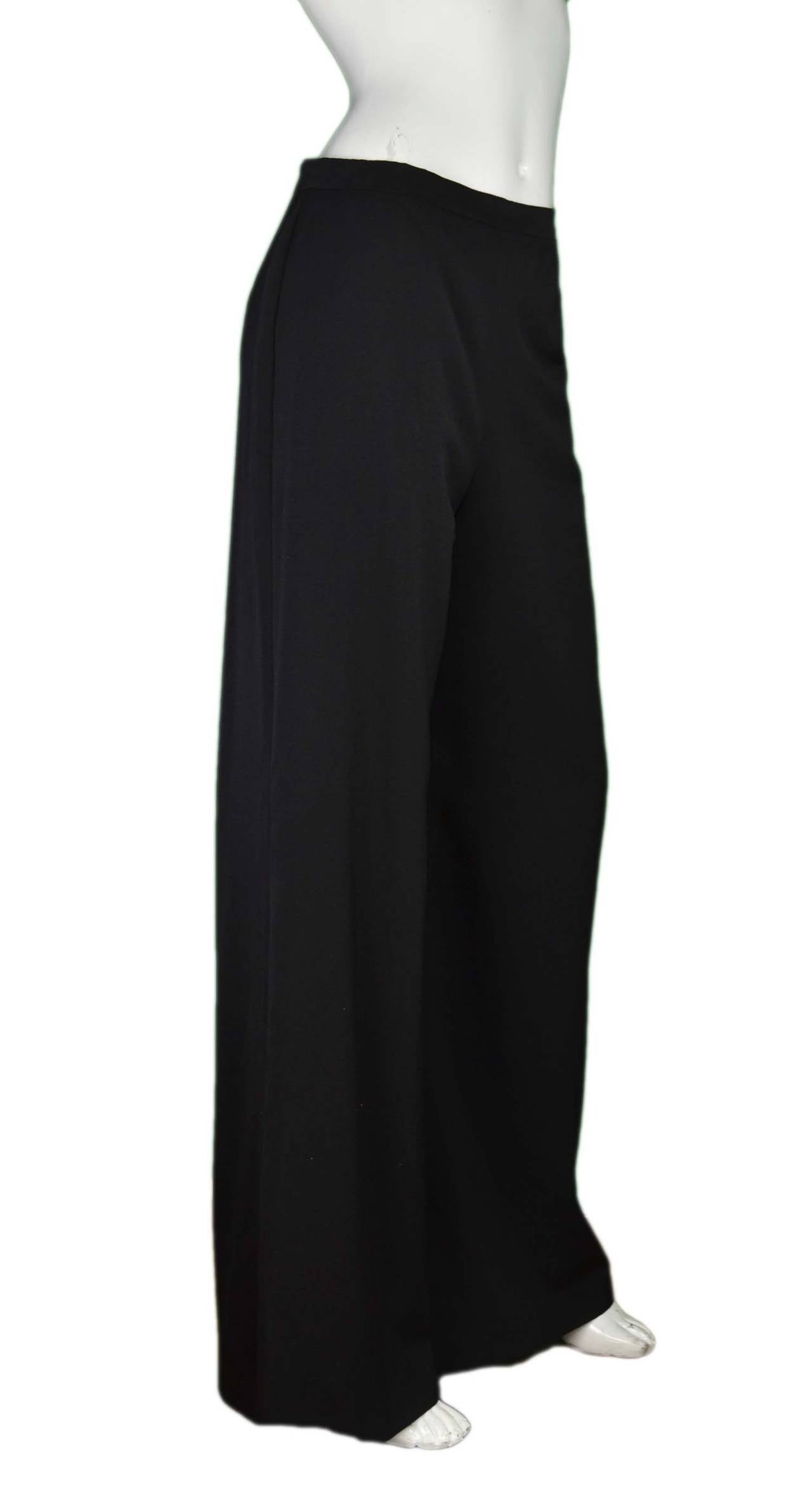 CHANEL Black Wide Leg Pants sz. 40
Made in: France
Year of Production: 2010-2014
Color: Black
Composition: 100% Wool
Lining: 100% Black Silk
Closure/opening: Side zipper with CC button
Exterior Pockets: Two pockets, one at each hip
Retail: