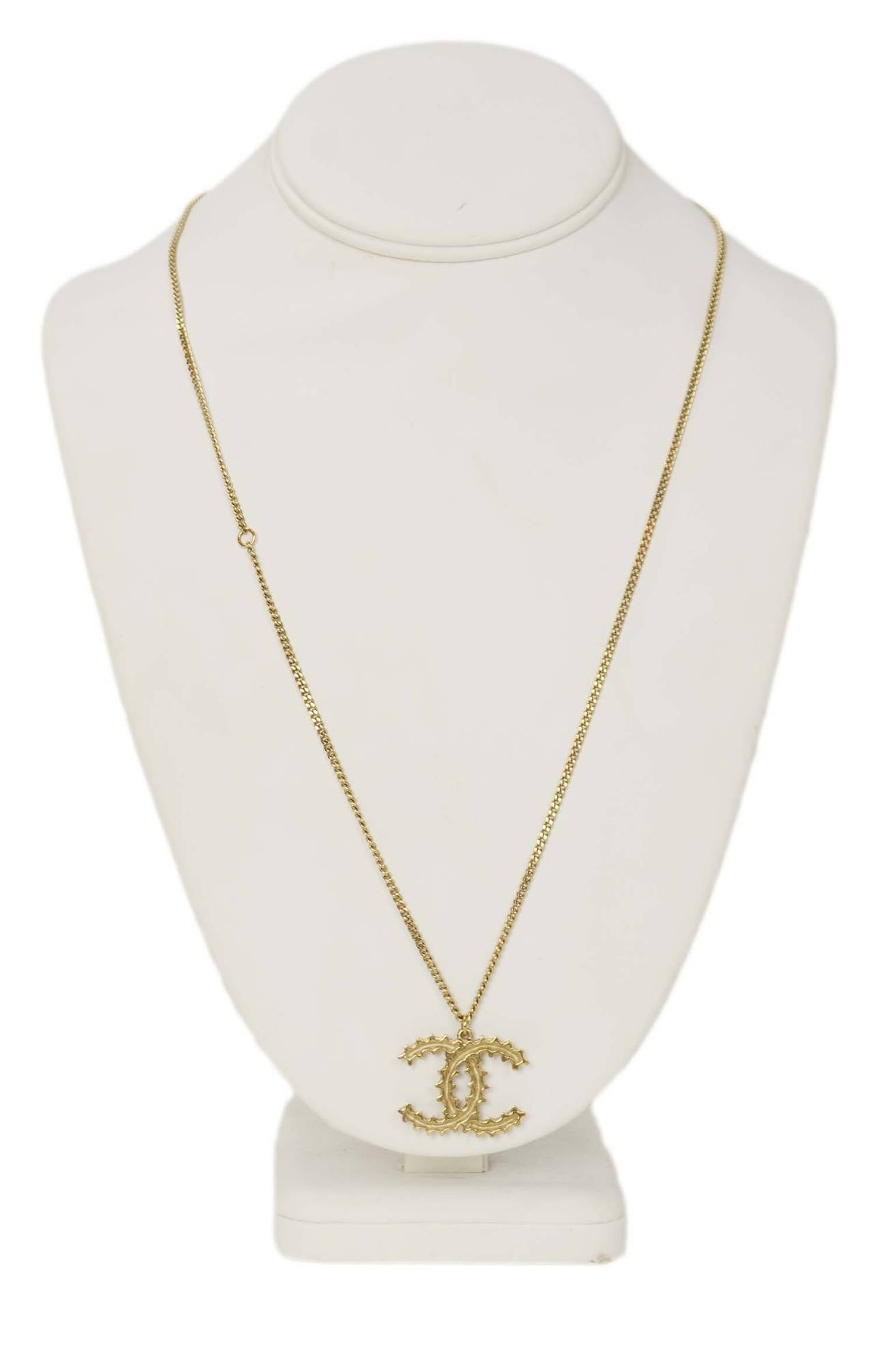 Chanel 2014 Goldtone Textured CC Charm Necklace
Features small CC charm at necklace closure and spring ring to shorten length

    Made in: France
    Year of Production: 2014
    Stamp: CHANEL A14 CC K
    Closure: Lobster claw
    Color: