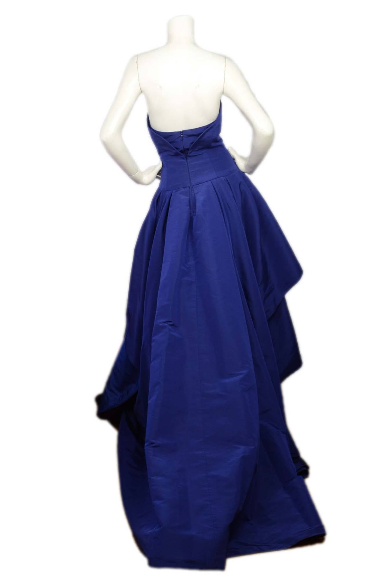 Features built in corset

-Color: Cobalt blue
-Composition: No composition break down- believed to be raw silk
-Tags: Oscar de la Renta
-Lining: 100% silk
-Closure/opening: Two back zippers- one at corset
-Exterior Pockets: None
-Interior