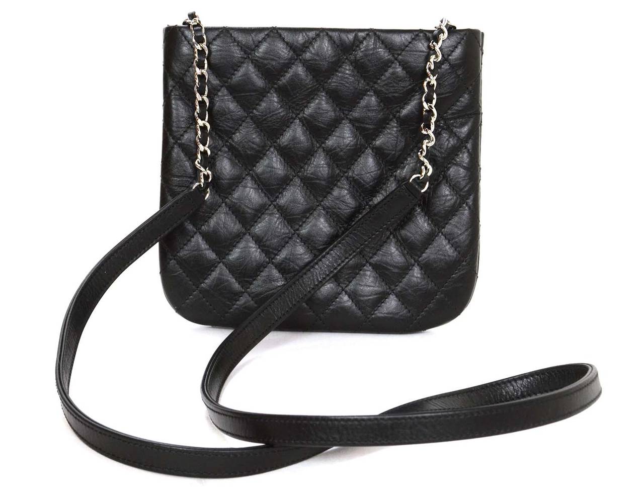 Chanel Black Quilted Leather Crossbody Bag SHW
Features CC logo at front center and silver chain link and leather crossbody strap

    Made in: Romania
    Year of Production: 2012-2013
    Color: Black and silvertone
    Hardware: