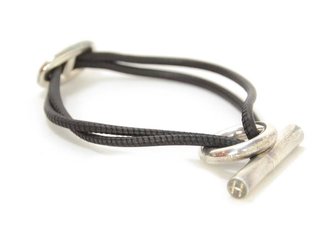 Hermes Black Leather Rope Bracelet w/Chain d'Ancre Toggle

    Made in: France
    Stamp: HERMES
    Closure: Sterling toggle
    Color: Black and Silver
    Materials: Leather and metal
    Overall Condition: Excellent with minor tarnishing