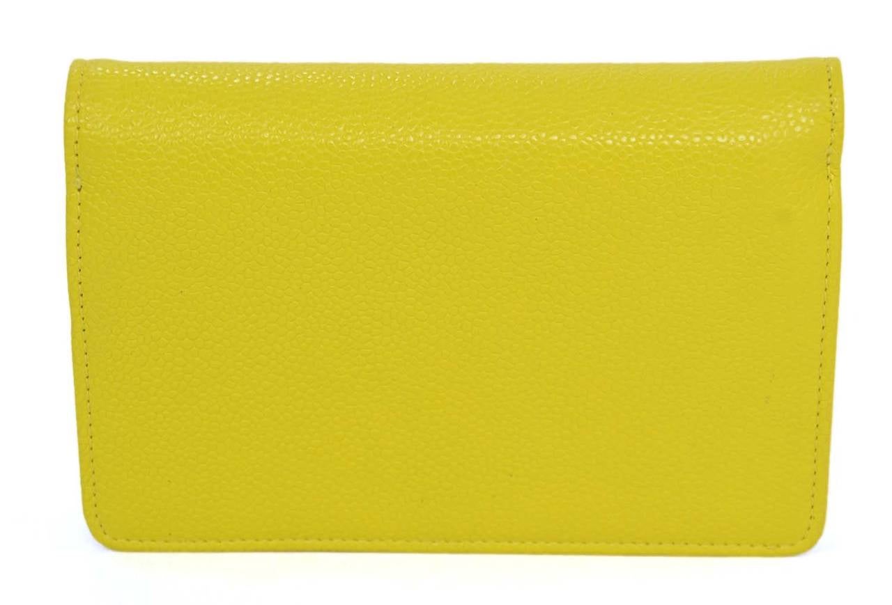 CHANEL Yellow Caviar Wallet w/ Stitched CC

    Made in: Spain
    Year of Production: 2014
    Color: Bright yellow with green undertones
    Materials: Caviar leather
    Lining: Smooth yellow leather
    Closure/opening: Snap closure
   