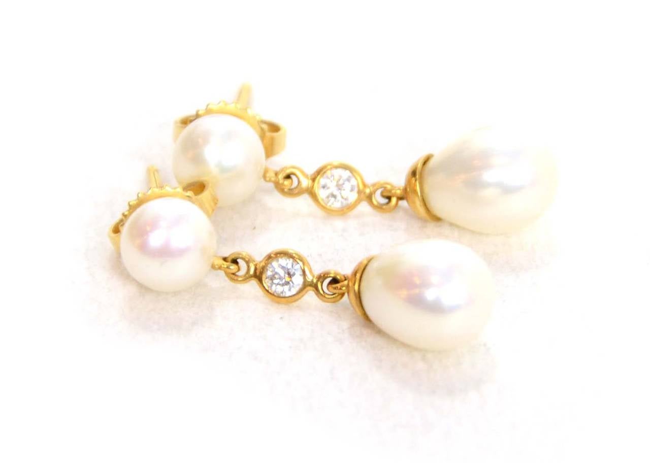 Tiffany & Co. Gold Pearl and Diamond Tear Drop Earrings

    Made in: U.S.A
    Closure: Pierced back
    Color: White and gold
    Materials: Gold, pearl, and diamond
    Overall Condition: Excellent- like new

Measurements:
Length: