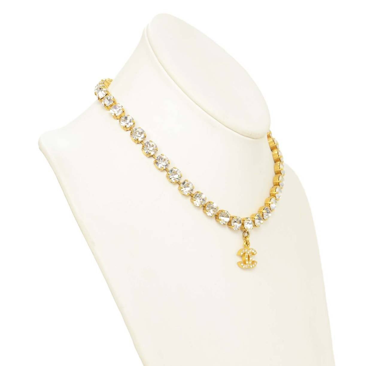 Chanel Vintage 1996 Goldtone & Rhinestone Necklace w/CC Pendant
Features double-sided rhinestone detailing on CC pendant

    Made in: France
    Year of Production: 1996
    Stamp: 96 CC A
    Closure: Hook and eye
    Color: Goldtone
   