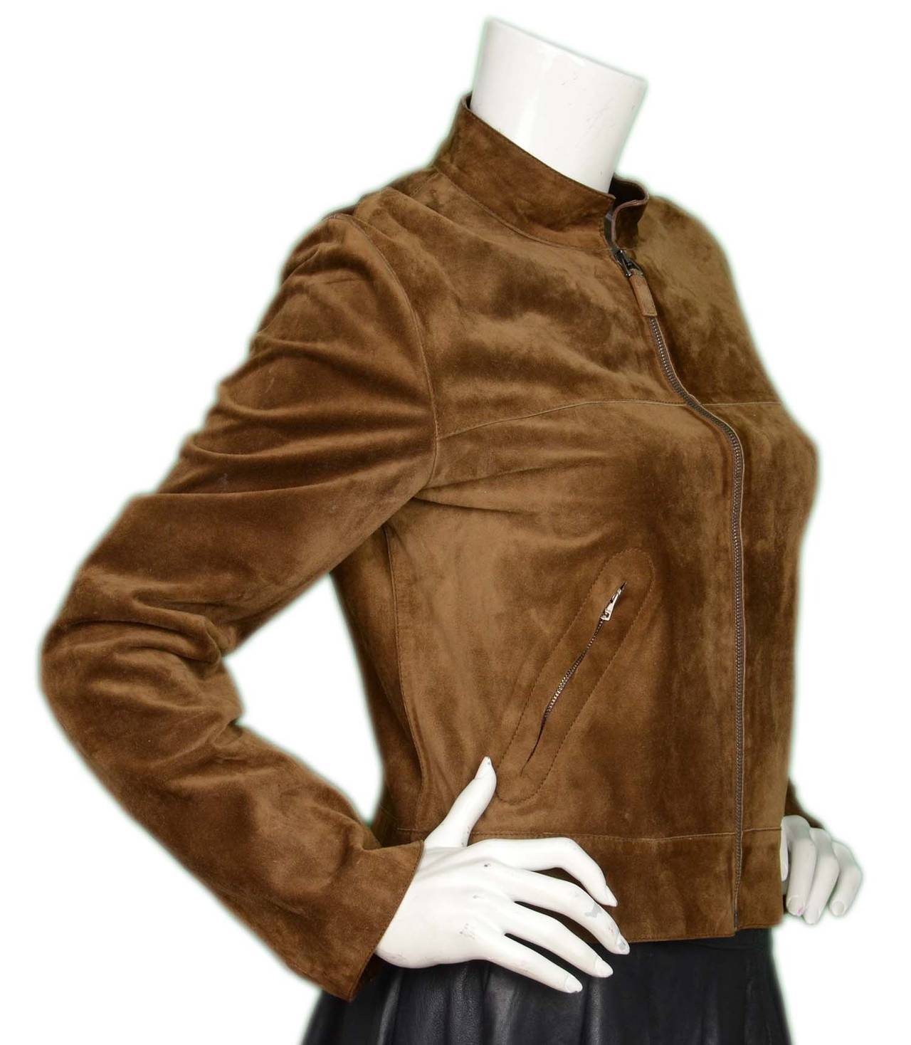 GUCCI Tan Suede Motorcycle Jacket sz. 44
Made in: Italy
Color: Tan/brown
Composition: 100% Suede
Lining: 100% Tan Leather
Closure/opening: Zipper closure
Exterior Pockets: Two zippered pockets
Overall Condition: Excellent pre-owned