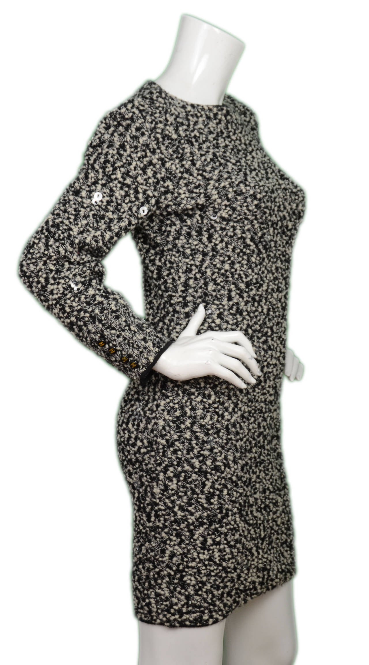 Features clear sequins throughout the dress

-Made in: Italy
-Year of Production: 1996
-Color: Black and white
-Composition: 85% Laine Wool, 15% Nylon
-Lining: 85% Wool, 15% Nylon
-Closure/opening: Slips on over the head
-Overall Condition: