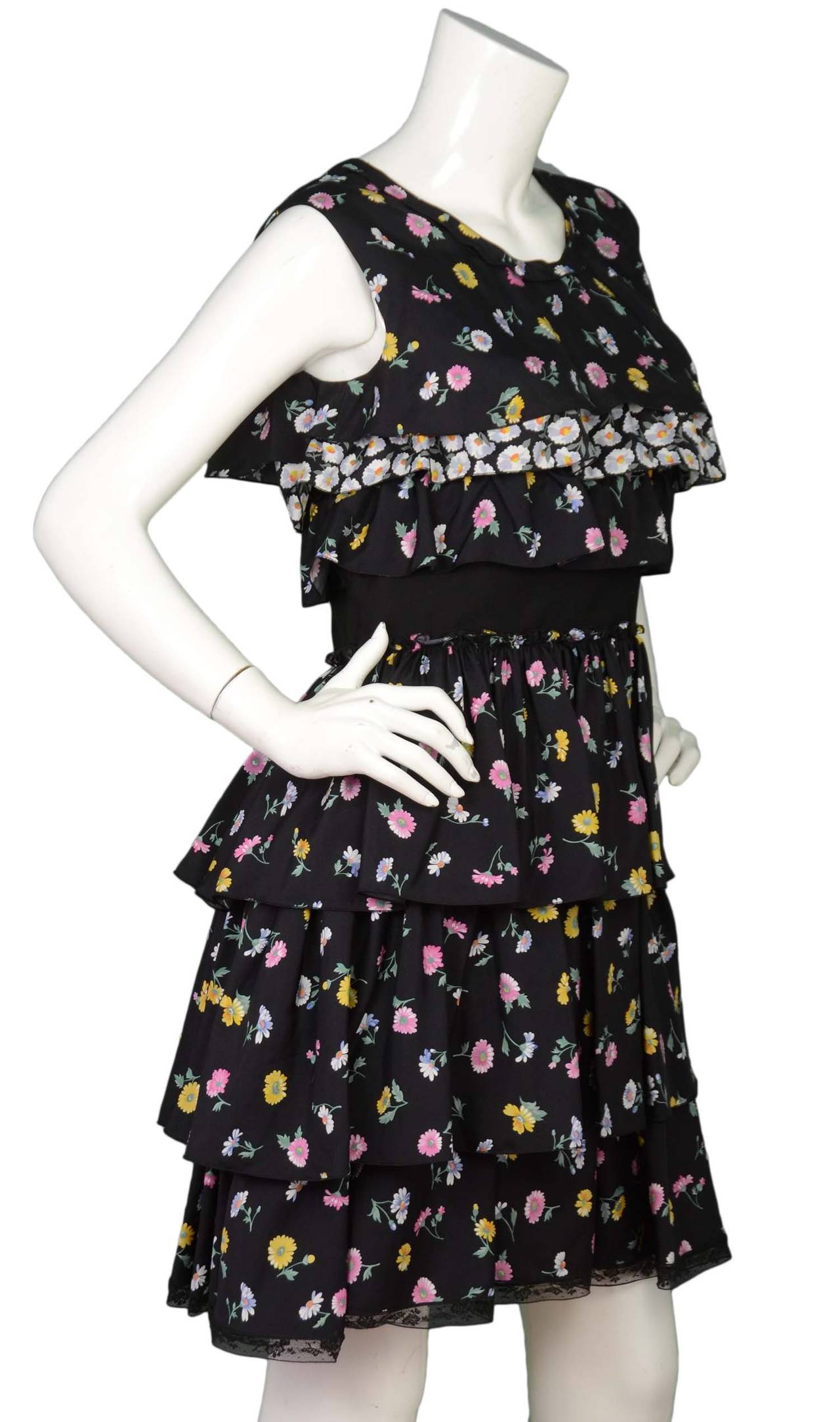 NINA RICCI Navy Silk Sleeveless Ruffle Floral Dress sz. 40
Made in: Slovakia
Color: Navy with floral print
Composition: 100% Silk
Lining: 100% Silk
Closure/opening: zipper in the back
Overall Condition: Excellent pre-owned condition
Marked