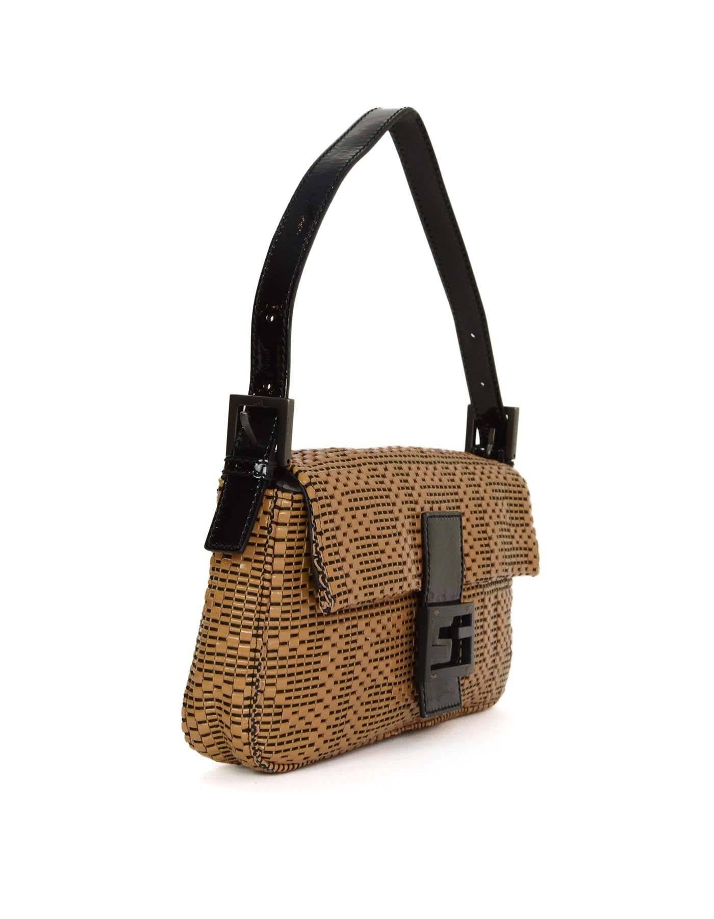 Fendi Woven Patent Beige Baguette Bag
Features woven leather that creates the Fendi logo and a Fendi forever clasp at the center. Removable shoulder strap for optional use as a clutch

Made in: Italy
Color: Beige and black
Hardware: