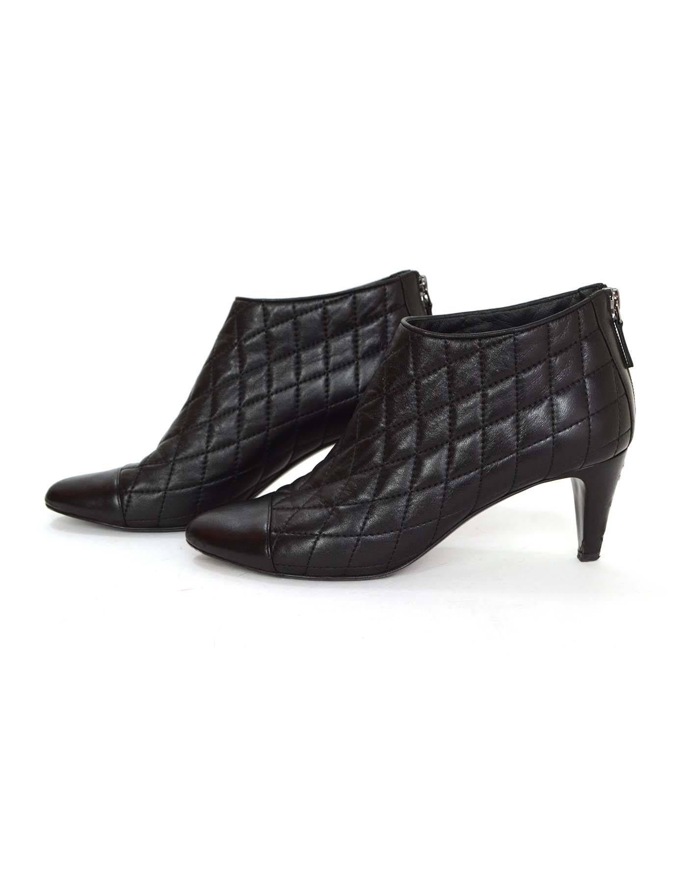 Chanel Black Leather Quilted Heel Booties sz 8.5
Features cap toe and silver CC hardware with back zipper tab closure

Made in: Italy
Color: Black
Composition: Leather 
Sole Stamp: CC Made in Italy 38 1/2
Closure/opening: 3