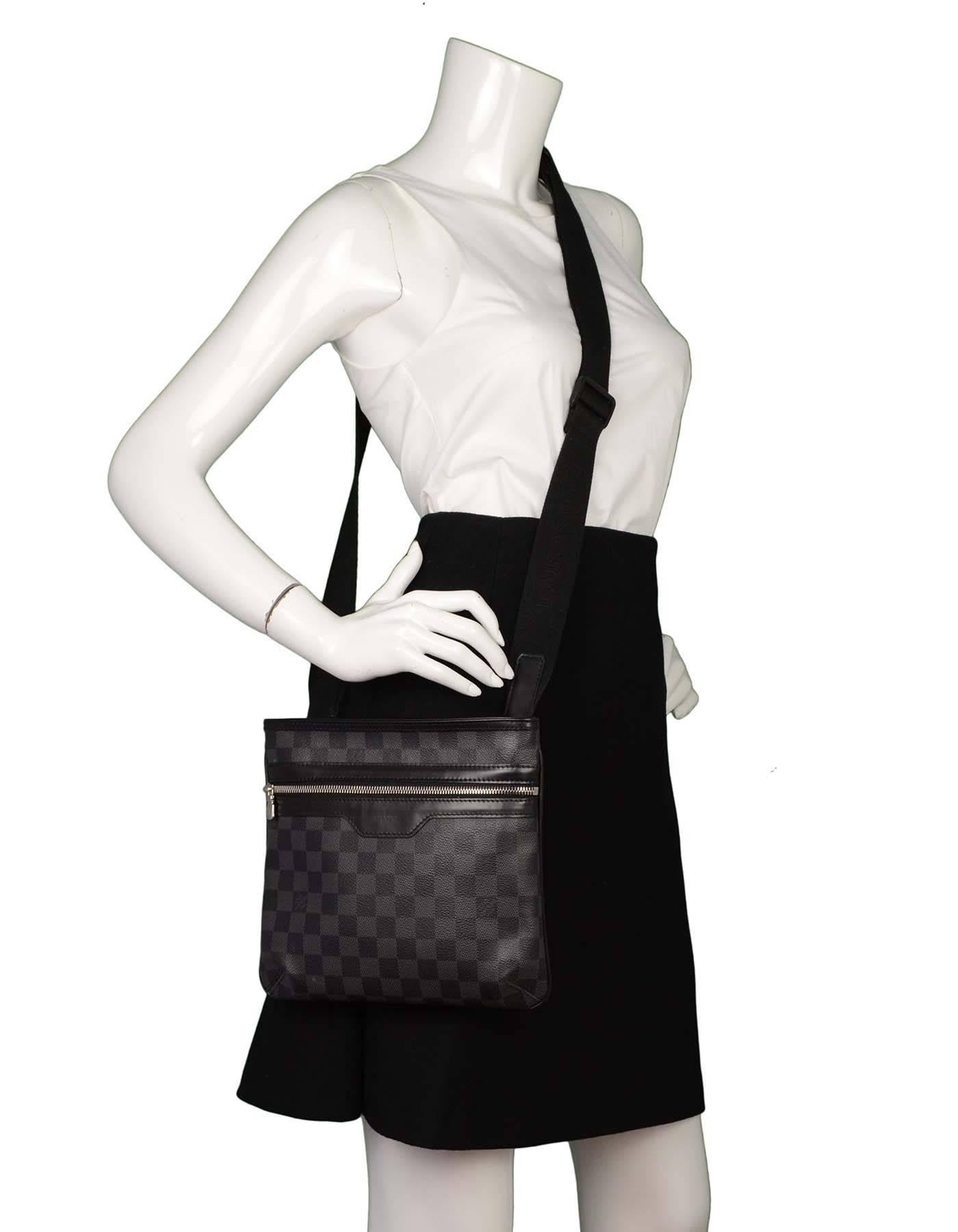 Louis Vuitton Damier Graphite 'Thomas' Messenger Bag
Features adjustable shoulder/crossbody strap
Made In: France
Year of Production: 2013
Color: Black and grey
Hardware: Silvertone
Materials: Coated canvas and leather
Lining: Black