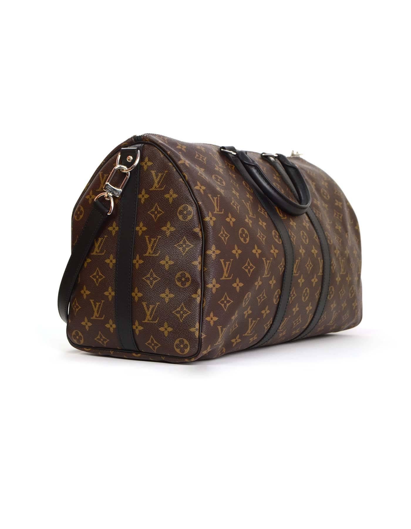 Louis Vuitton Monogram Keepall Bandouliere 45 Luggage 
Features black leather trim throughout
Made In: France
Year of Production: 2015
Color: Brown and black
Hardware: Silvertone
Materials: Coated canvas and leather
Lining: Brown