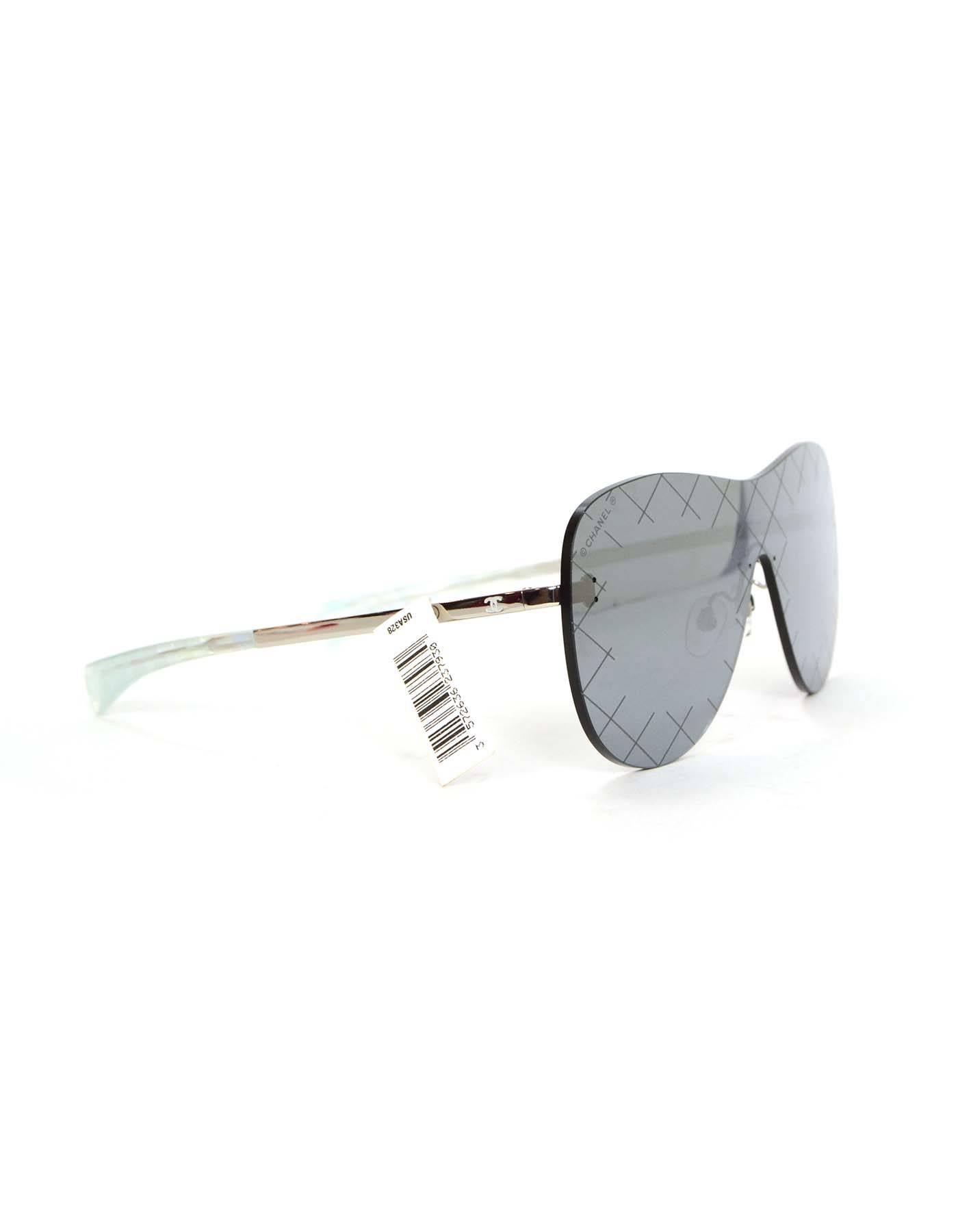 Chanel NEW '16 Silver & Grey Shield Mirror Aviator Sunglasses 
Features light quilting around edges of lenses
Made In: Italy
Year of Production: 2016
Color: Grey silver
Materials: Metal and glass
Identification Number: BC18801728
Stamp: Left