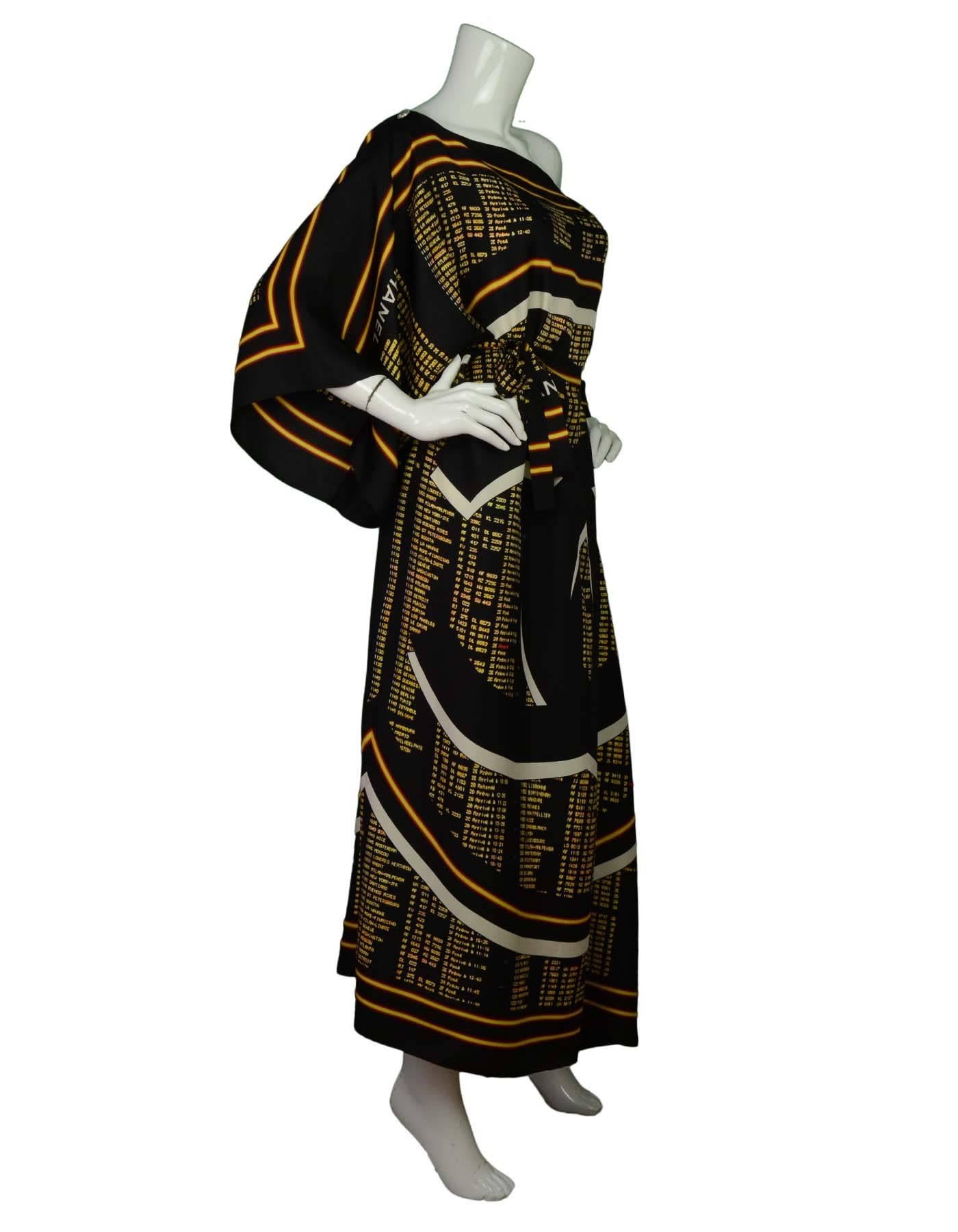 Chanel NEW '16 Black & Gold Printed Kaftan 
Features airline departure/arrival boards printed throughout with large CC logo in center
Made In: France
Year of Production: 2016
Color: Black, red, yellow and white
Composition: 100% silk
Lining: