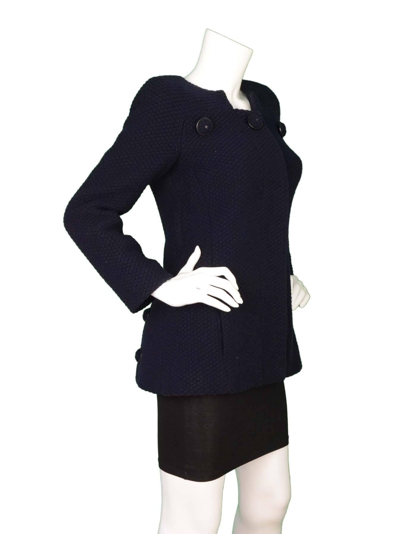 Chanel NEW Navy Wool Jacket  
Features three large navy wool covered bottons across neckline

Made In: France
Year of Production: 2015
Color: Navy
Composition: 80% wool, 20% nylon
Lining: Navy, 100% silk
Closure/Opening: Button down