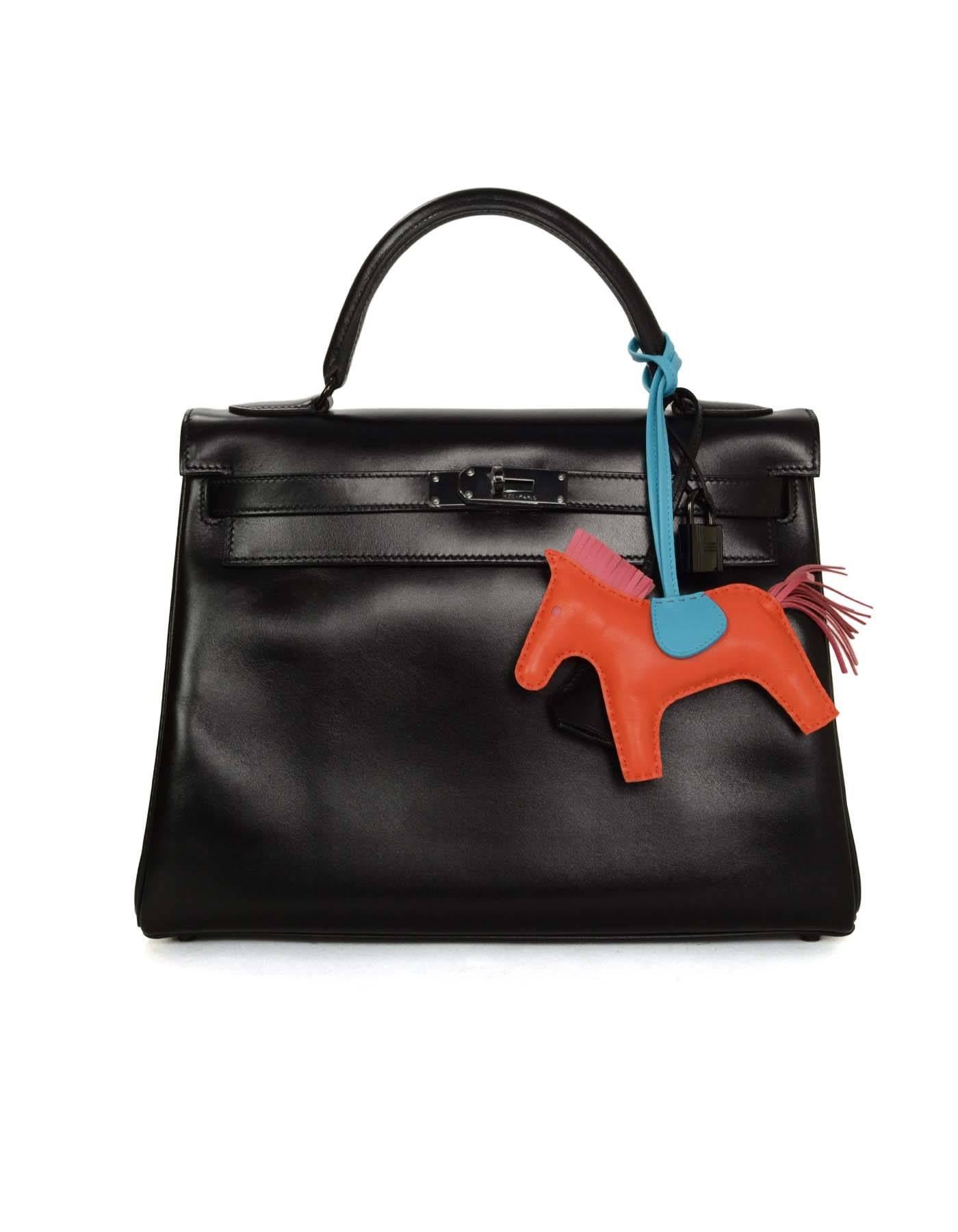 Hermes '16 Orange Poppy, Rose Azalea & Blue Izmir Rodeo Horse Charm 
Made In: France
Year of Production: 2016
Color: Orange pooppy, rose azalea and blue izmir
Materials: Leather
Closure/Opening: None
Stamp: Hermes Paris Made in France
Overall