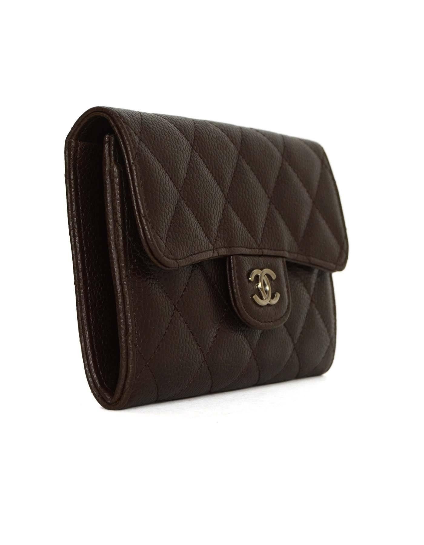 Chanel Brown Quilted Caviar Leather Flap Short Wallet SHW
Features CC logo push button closure

Made in: France
Year of Production: 2008
Color: Brown and silvertone
Hardware: Silvertone
Materials: Leather, textile, and metal
Lining: Brown