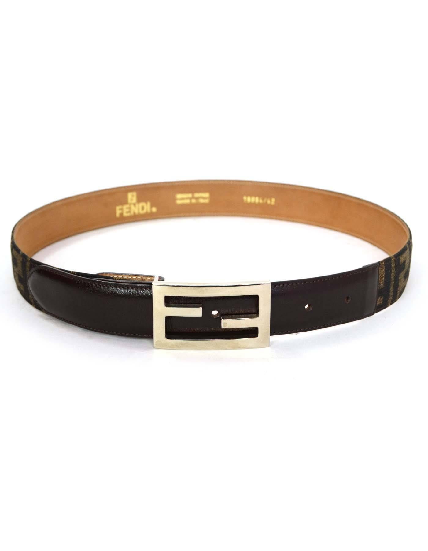 Fendi Brown & Canvas Zucca Print Belt
Features Fendi silvertone logo buckle
Made In: Italy
Color: Brown
Hardware: Silvertone
Materials: Leather and canvas
Closure/Opening: Stud and notch closure
Stamp: 15654/42
Overall Condition: Excellent