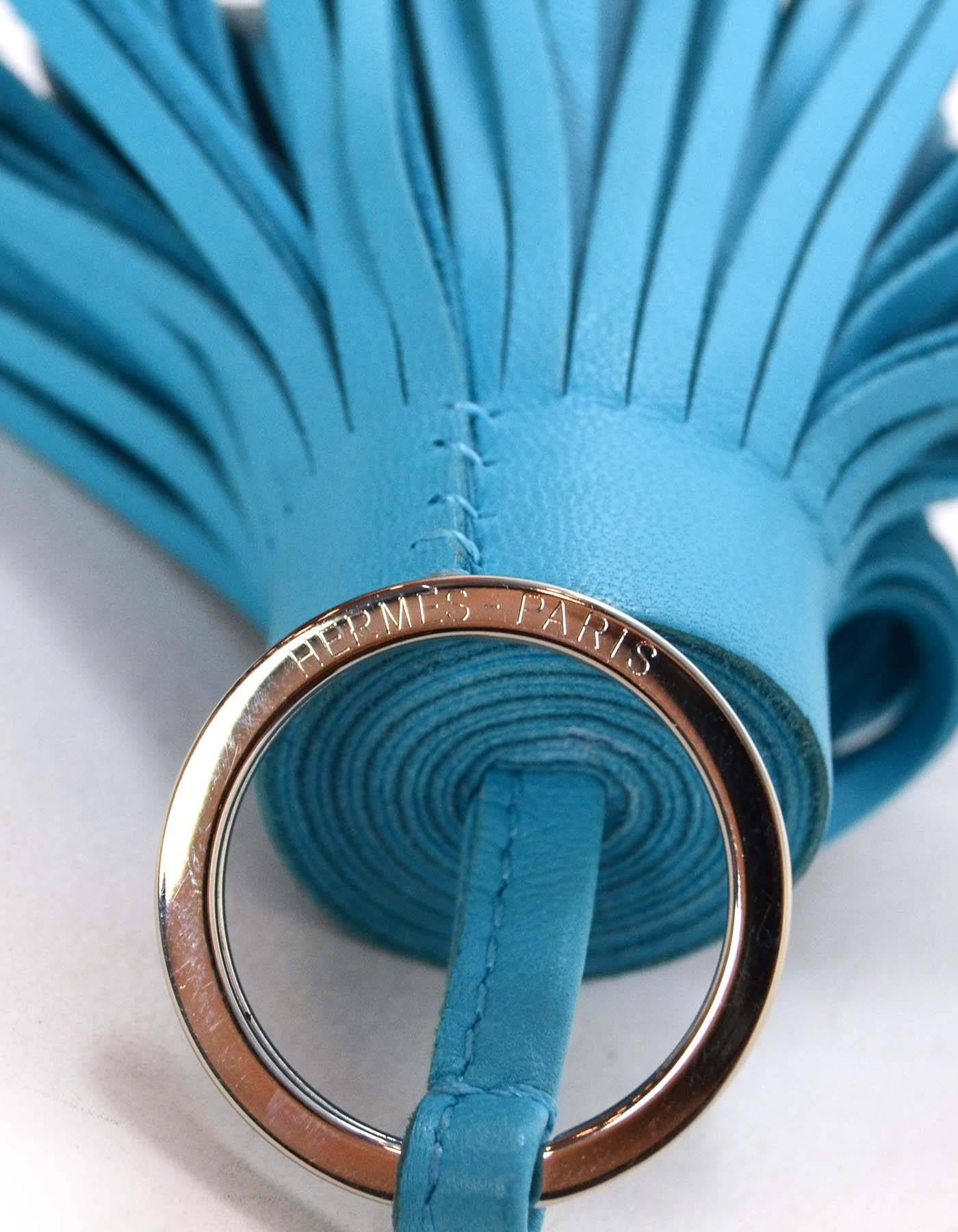 Hermes Turquoise Carmen Tassel Key Ring
Color: Turquoise
Hardware: Palladium
Materials: Leather
Closure/Opening: None
Stamp: Hermes Paris 
Overall Condition: Excellent pre-owned condition
Measurements: 
Total Length: 4.5