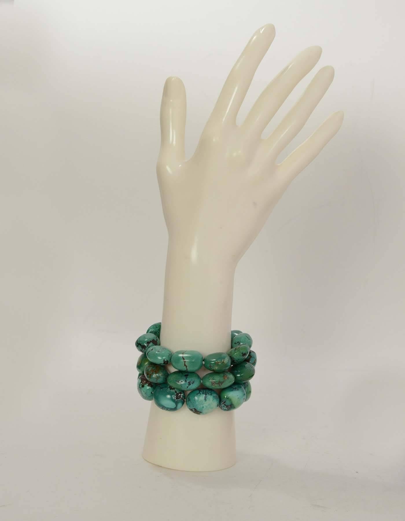 Ralph Lauren Turquoise Multi-Strand Bracelet 
Features sterling silver clasp
Color: Turquoise and silver
Materials: Sterling silver and stone
Closure: Sliding bar clasp
Stamp: 