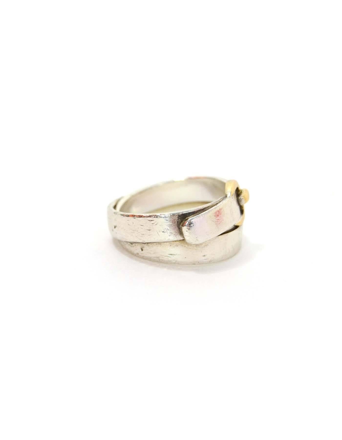 Hermes Sterling Wrap Around Buckle Ring 
Features goldtone buckle

Color: Silver and goldtone
Materials: Sterling silver
Closure: None
Stamp: Hermes 925 48
Overall Condition: Good pre-owned condition with the exception of nicks and scratching