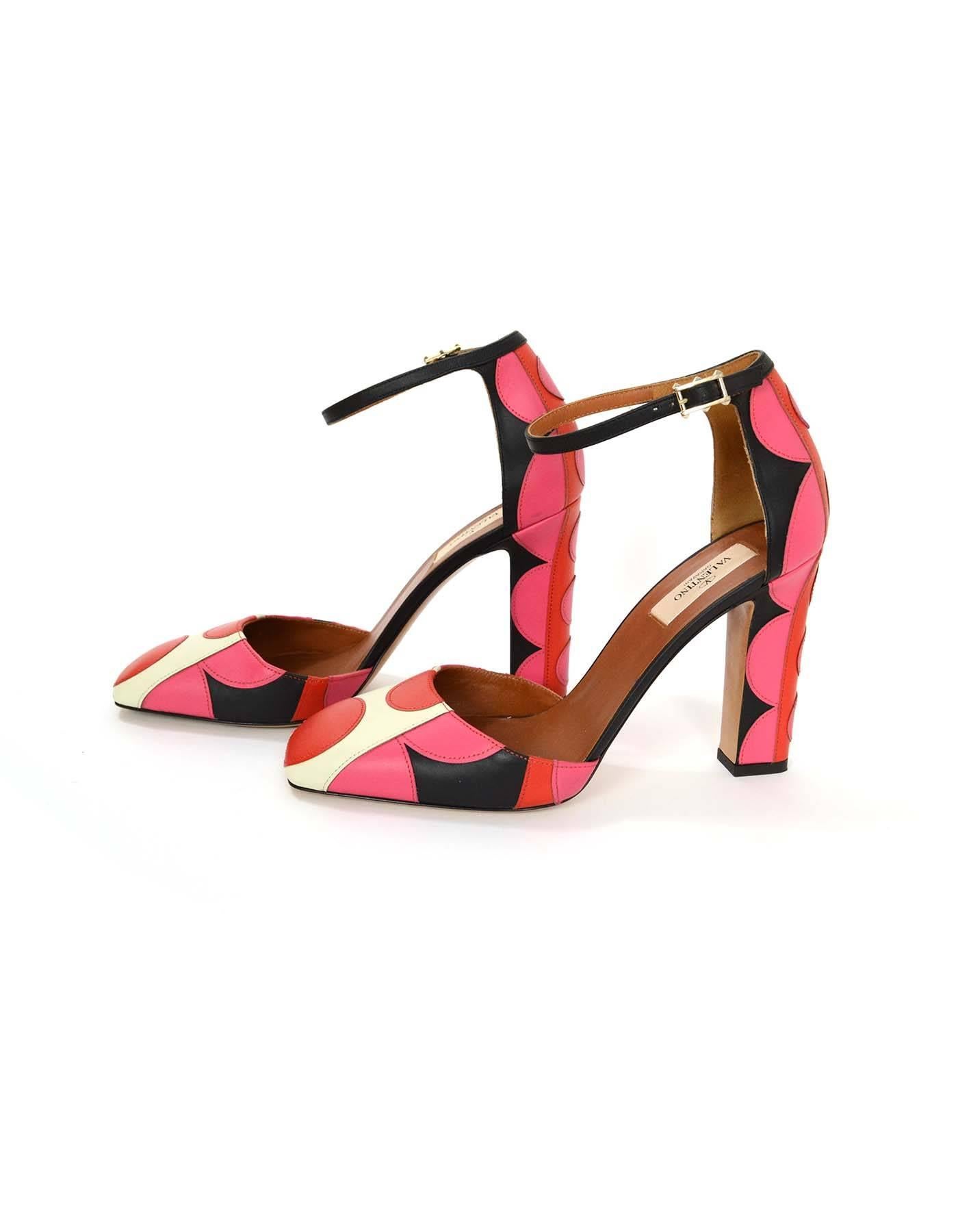 Valentino Red & Pink Polka Dot Pumps 
Features layered leather polka dots stitched throughout
Made In: Italy
Color: Black, cream, red and pink
Materials: Leather
Closure/Opening: Ankle strap with buckle and notch closure
Sole Stamp: Valentino