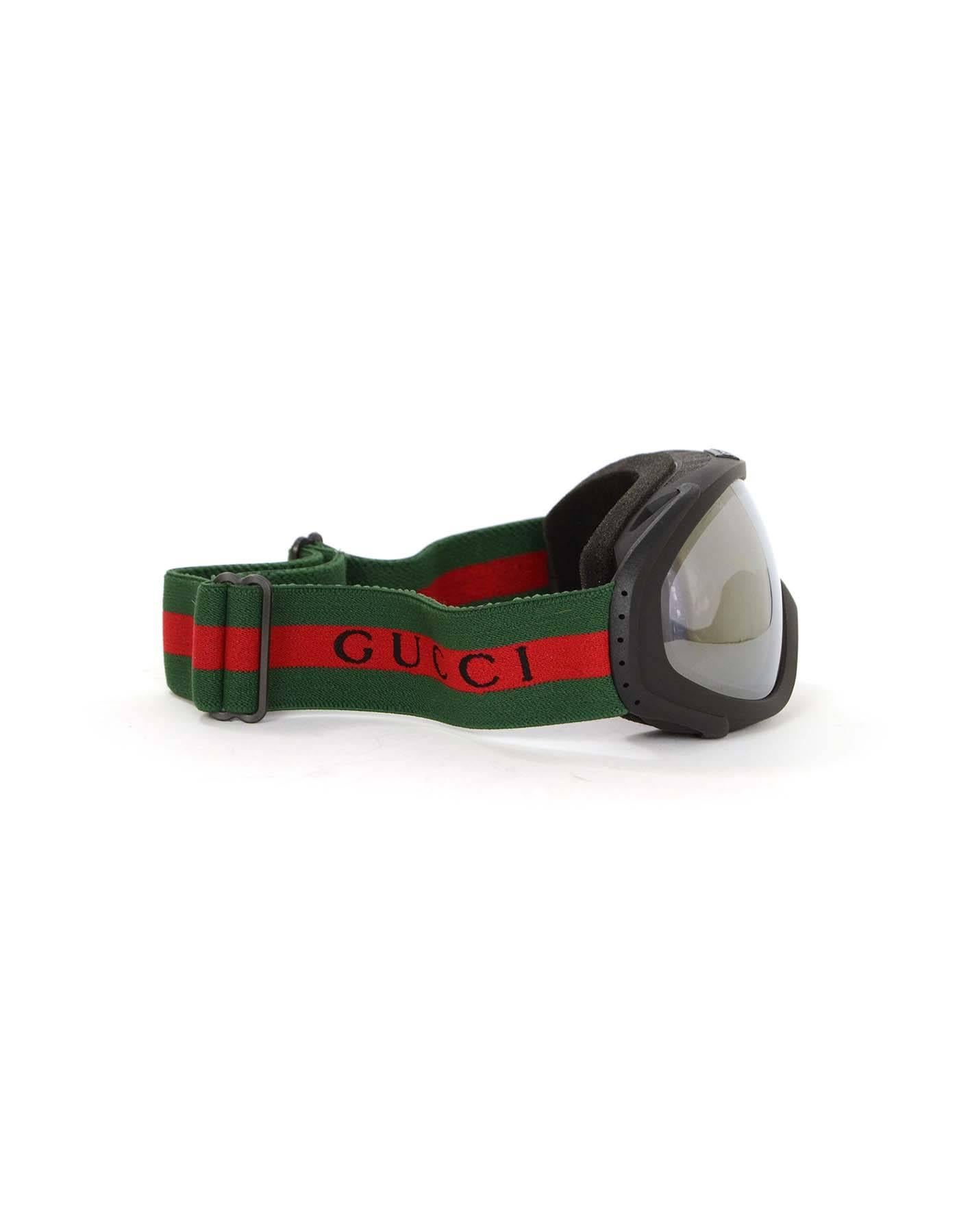 Gucci Black Frame Ski Goggles
Features Gucci logo with signature green and red adjustable head strap band

Made In: Slovenia
Color: Black, green and red
Materials: 100% PVC
Stamp: None
Retail Price: $431 + tax
Overall Condition: Excellent