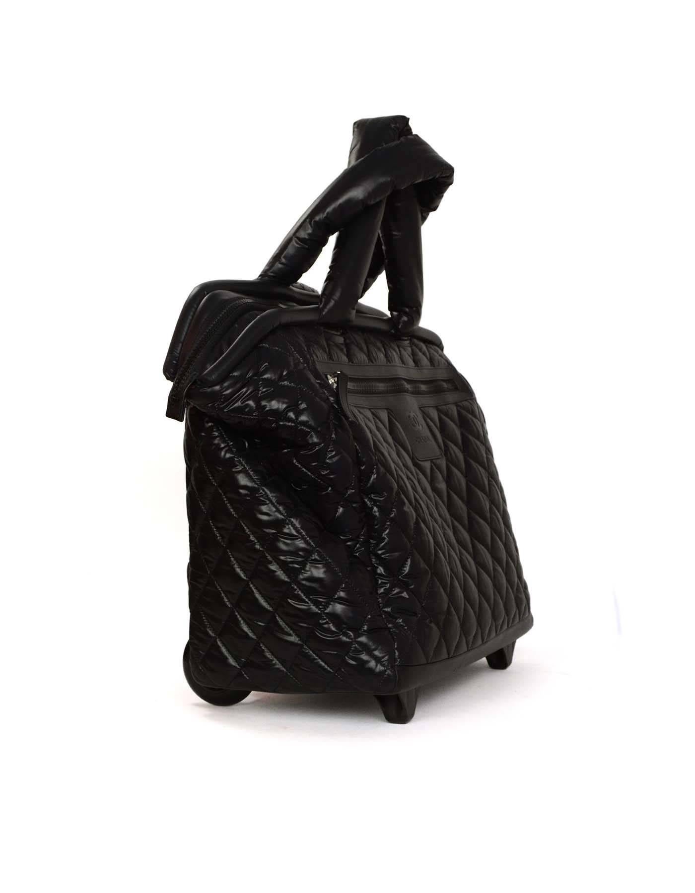 Chanel Black Coco Cocoon Quilted Trolley Luggage 
Features interlocking double-C logo embossed leather detail at front 

Made In: Italy
Year of Production: 2013
Color: Black
Hardware: Silver 
Materials: Nylon, leather and metal
Lining: