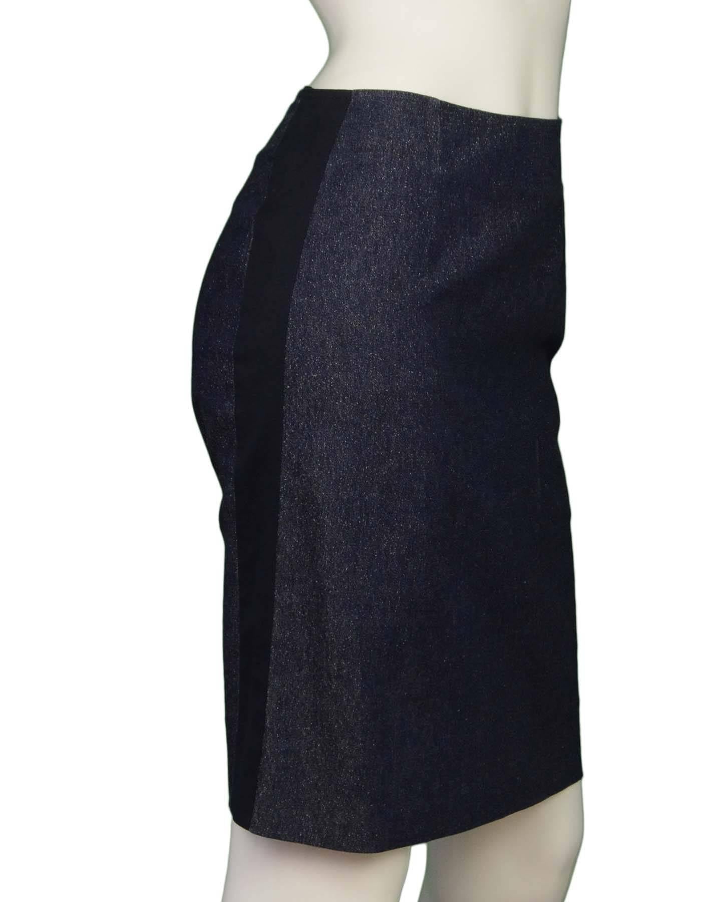 Chanel Blue Glitter Denim Pencil Skirt 
Features glitter threading throughout denim and two navy stripes down each side
Made In: Italy
Year of Production: 2000
Color: Blue and navy
Composition: 90% cotton, 8% polyester, 2% spandex
Lining: