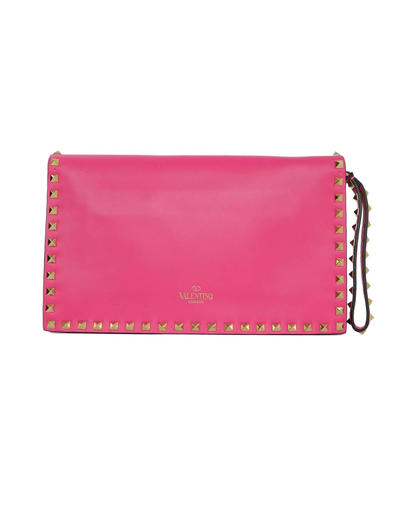 Valentino Hot Pink Leather Rockstud Flap Clutch SHW
Features flap top with iconic Valentino pyramid studs.  Can be worn as a wristlet or clutch

Made In: Italy
Color: Hot Pink
Hardware: Silvertone
Materials: Leather and metal
Lining: Beige